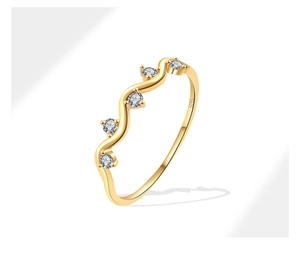 Close-up of S925 hallmark on wavy gold ring with five inset cubic zirconia stones