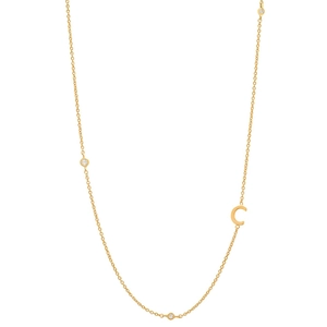 Detail of 18K gold-plated C-letter necklace featuring delicate chain and round crystal accents