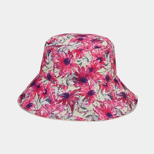 Detail of floral sunflower bucket hat with pink and purple blossoms on sage green canvas