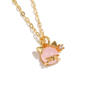 Macro shot of 18K gold plated necklace with cute pink crystal cat pendant and zircon