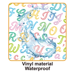 Macro shot of waterproof vinyl letter stickers showing splashing water droplets