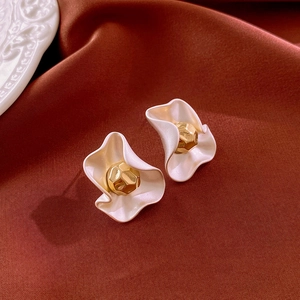 French style metallic pleated flower studs in white and gold on a satin background