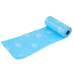 Detailed view of a blue pet waste bag roll with white paw print patterns on a white background