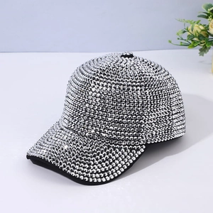 Detailed close-up showing the dense shimmering rhinestones on a silver baseball cap