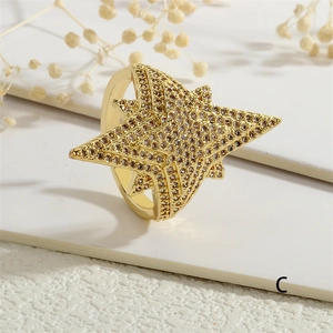Macro shot of 18K gold plated star ring featuring micropave white cubic zirconia inlay