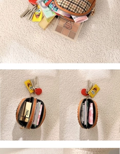 Detail showing two zipper compartments of a houndstooth coin purse on a soft beige rug