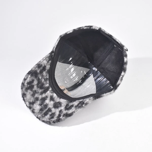 Detail view of the leopard print faux shearling baseball cap with its inner structure