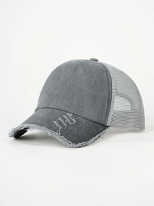 Close-up of a distressed dark grey trucker hat with washed cotton and mesh back