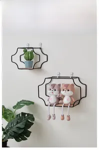 Detail of minimalist black metal wall shelf with wooden base for home decor