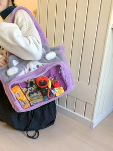 Purple plush cat-themed tote bag with a clear PVC display window for accessories