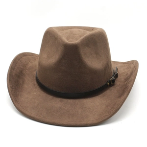 Detail view of brown suede cowboy hat featuring metal buckle and wide upturned brim