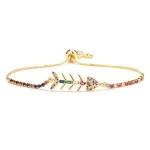 Adjustable gold fishbone bracelet featuring vibrant rainbow cubic zirconia accents