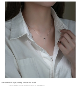S925 sterling silver bean necklace on neck, minimalist teardrop pendant jewelry detail
