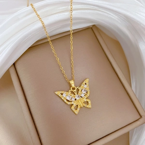 Elegant gold-plated butterfly necklace with sparkling crystals on premium silk backdrop