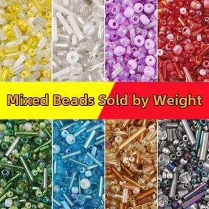 Close-up of vibrant 2mm-4mm glass seed beads and tube beads for DIY crafts in 8 colors