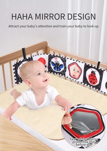 Detail of baby soft cloth book with haha mirror and high contrast sensory patterns