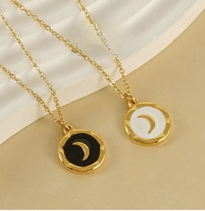 Detail view of round 18K gold-plated stainless steel crescent moon enamel pendants