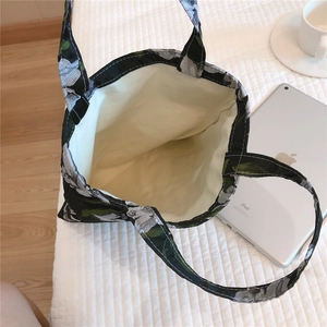 Top view of floral canvas tote bag showing spacious interior and light cotton lining