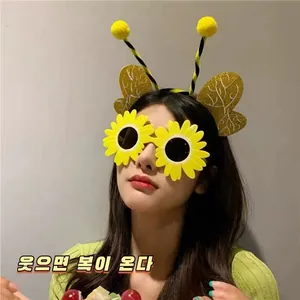 Kid bee headband with yellow fuzzy antennae and matching sunflower sunglasses for party