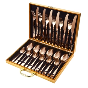 24-piece rose gold stainless steel cutlery set neatly organized in a golden gift box
