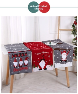 Close-up of knitted Christmas table runners featuring gnomes and snowflake patterns