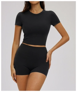Detailed front view of black tight yoga t-shirt and high waist compression shorts set