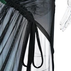 Detail view of black sheer mesh fabric with pleated design and tie-up structure on dress