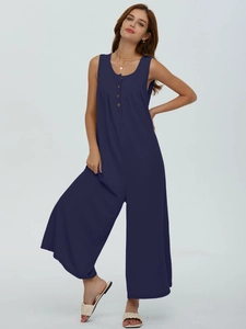 Detail of dark blue ribbed sleeveless jumpsuit with button front and wide leg cut