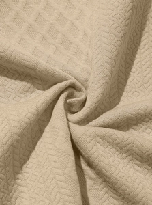 Detailed close-up showing the beige waffle knit fabric texture of the men's casual shirt