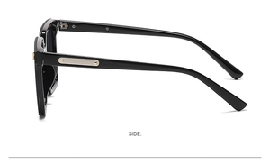 Close-up of wide temple design with metallic accent plate on black square sunglasses