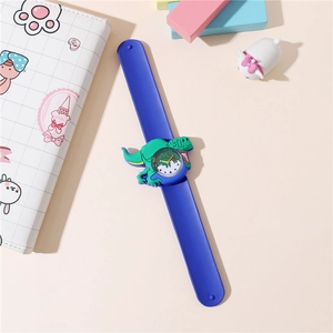 Detailed close-up of a blue silicone kids slap watch with a green dinosaur cartoon dial