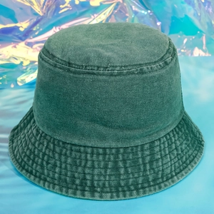 Detail of washed green denim bucket hat showing cotton texture and stitching