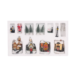 Macro view of Christmas village miniature set with LED lights in protective packaging