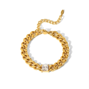 Macro shot of 18K gold plated Cuban link bracelet with square-cut zirconia and lobster clasp