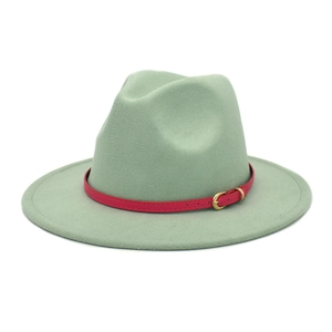 Detail view of the mint green wool fedora hat featuring a contrasting pink leather belt buckle