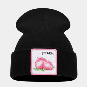 Detailed view of black knit beanie featuring a peach fruit patch with pink embroidery