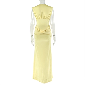 Detail view of the gathered ruched back and deep V-neckline on this yellow bodycon dress
