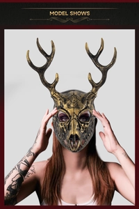 Detail of bronze deer skull mask featuring intricate sun eye emblem and long antlers