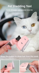 Detail of pink pet grooming brush with stainless steel teeth and easy cleaning button