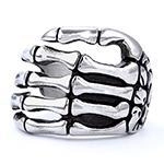Detailed view of vintage gothic skeleton hand ring with retro silver oxidation finish