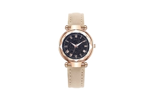 Detail of rose gold case with starry blue dial and faceted glass on starry sky watch
