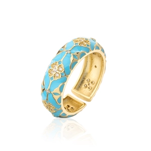 Close-up of golden four-leaf clover ring with turquoise enamel and zircon stones