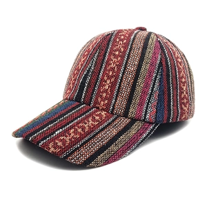 Macro detail of Bohemian baseball cap showing colorful ethnic woven texture and patterns