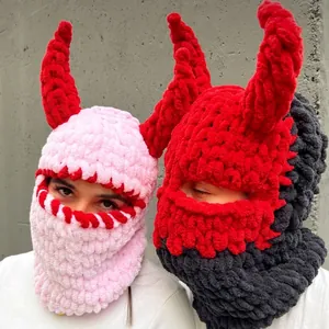 Detail of thick knitted devil horn balaclava showing soft texture and warm winter fabric