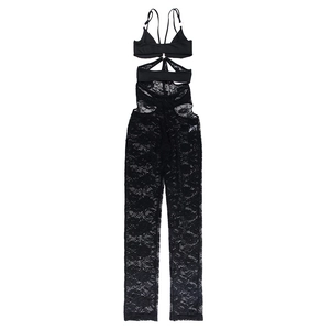 Close-up of intricate black floral lace texture and hollowed-out cutout detail on bodysuit