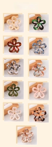 Detailed grid view of hollow flower claw clips in various tortoiseshell and marble patterns