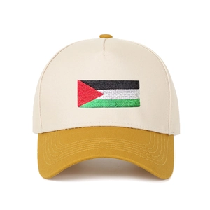 Detail of Palestine flag embroidery on two-tone cream and yellow baseball cap brim