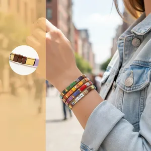Close-up of colorful Tila bead bracelets with Bohemian style on a woman's wrist