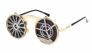 Macro shot of steampunk gold metal frames with gear and wheel decorations on lenses