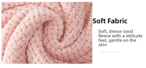 Detailed texture of soft pink coral fleece fabric with a high density fluffy finish